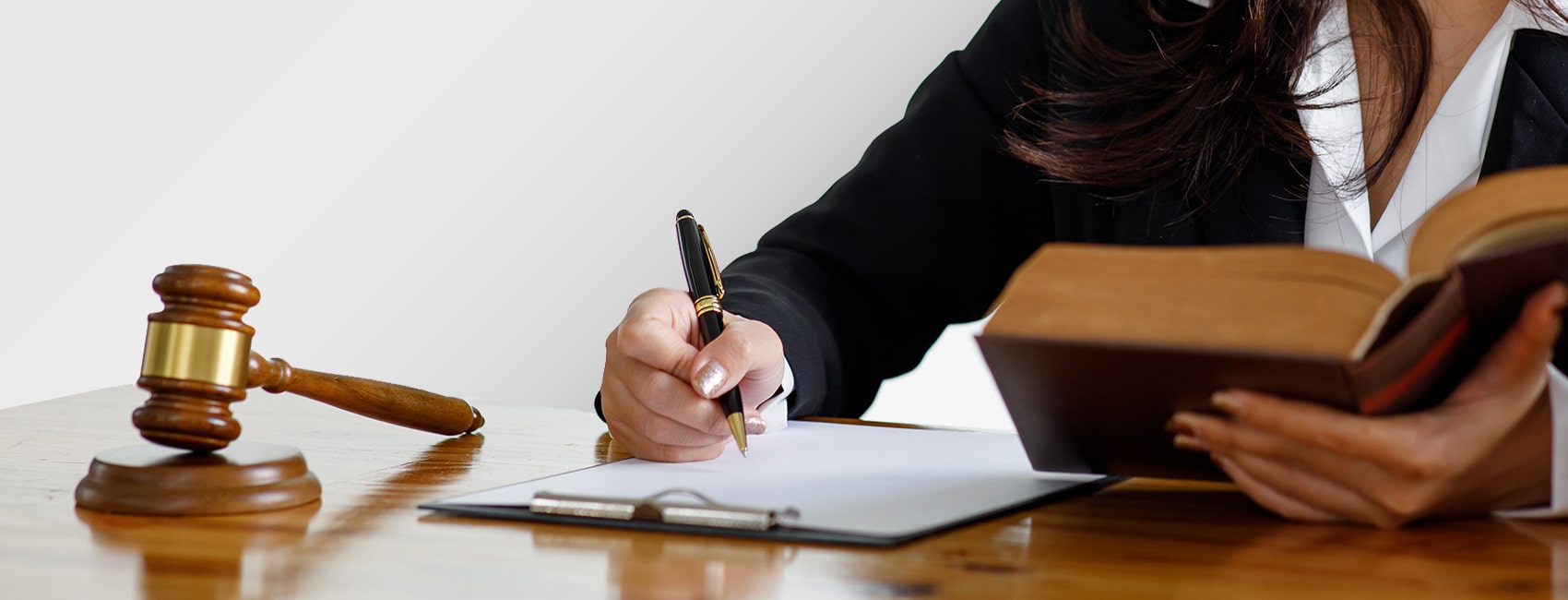 lawyer sitting at their desk and writing